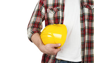 Man in construction industry dress with hardhat
