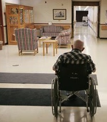 Nursing home facility with elderly male in wheelchair