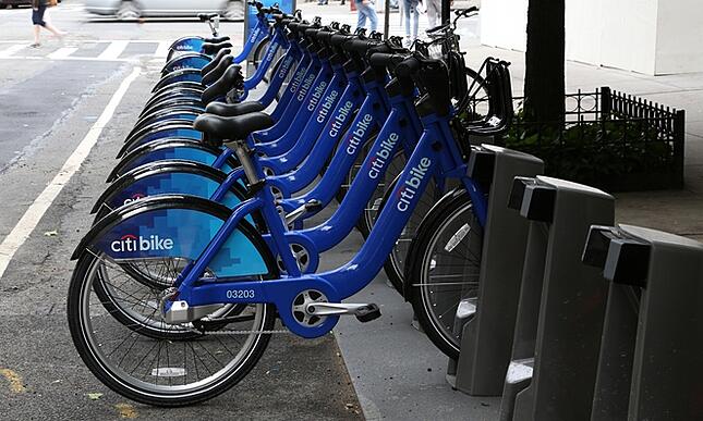 Bikes in a row at bike sharing service kiosk