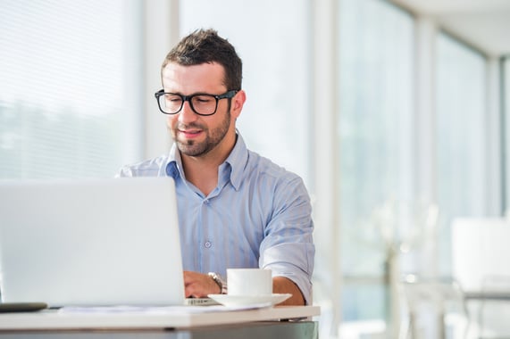 Businessman at work with laptop in his office-1