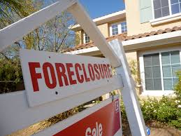 Foreclosure sign in yard of house