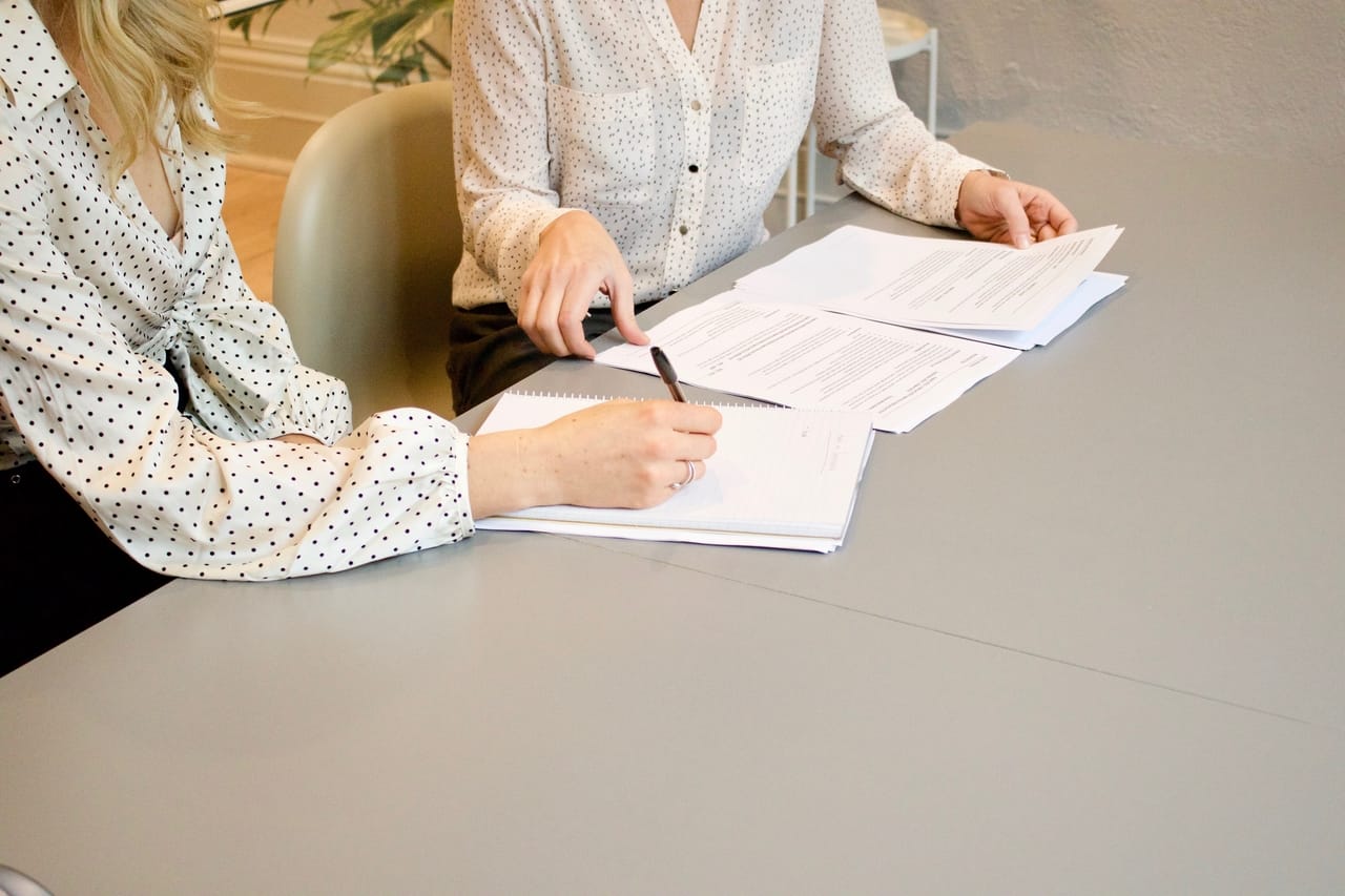 woman-signing-document